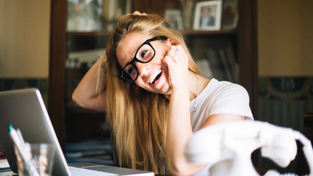 Person looking happy inside a laptop